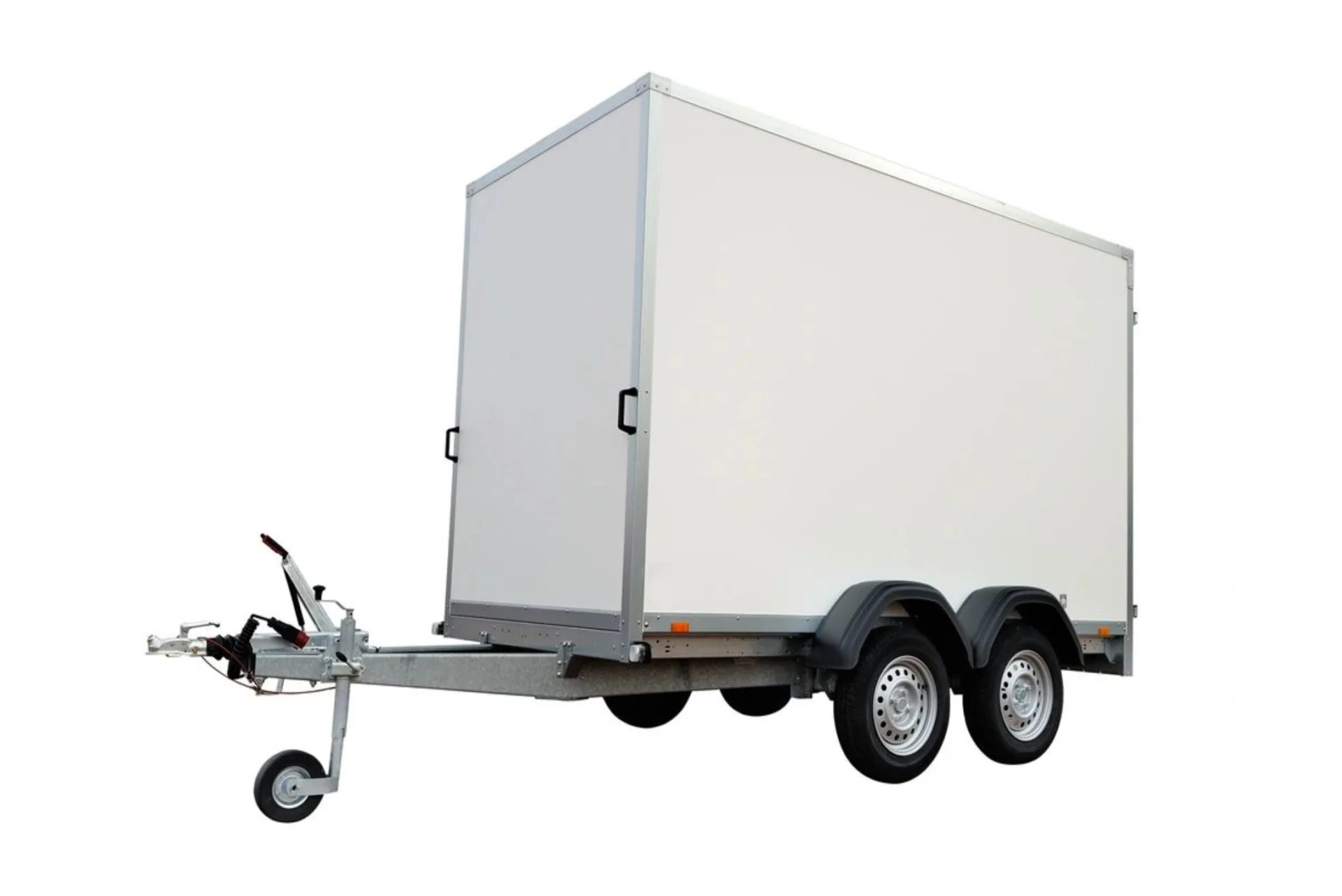 A trailer with a large white box on it.